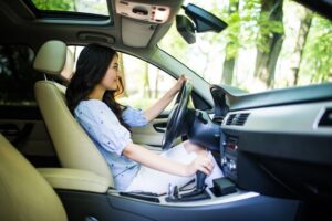 Girl driving a stick shift car