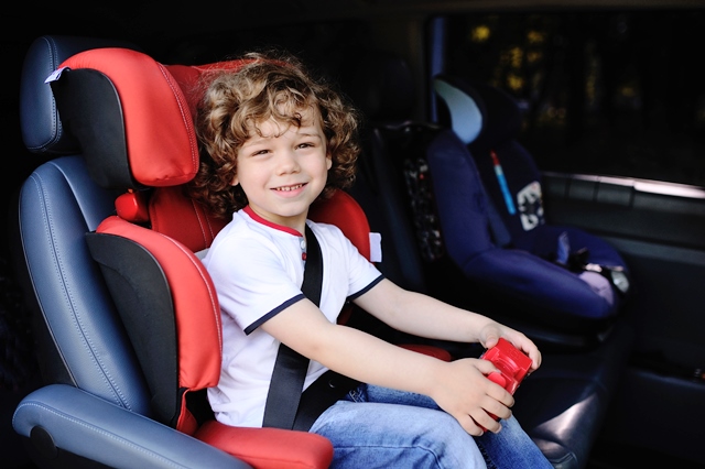 Child in car seat in car